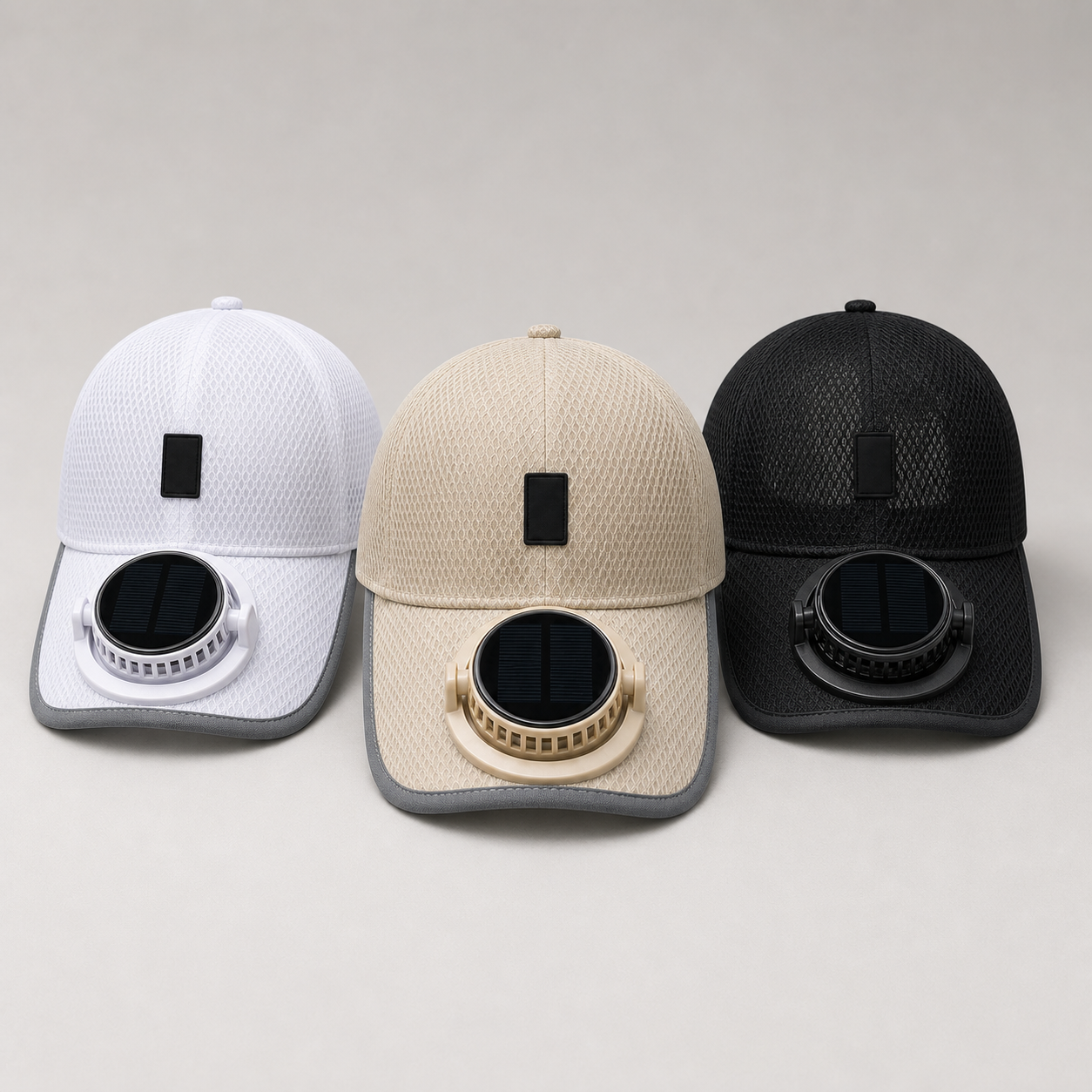 Clean studio lineup of white, beige, and black mesh fan caps.